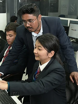 Teacher guiding student in the best skills university for career-oriented courses India