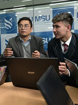 Teacher and student discussing in the best university in Sikkim
